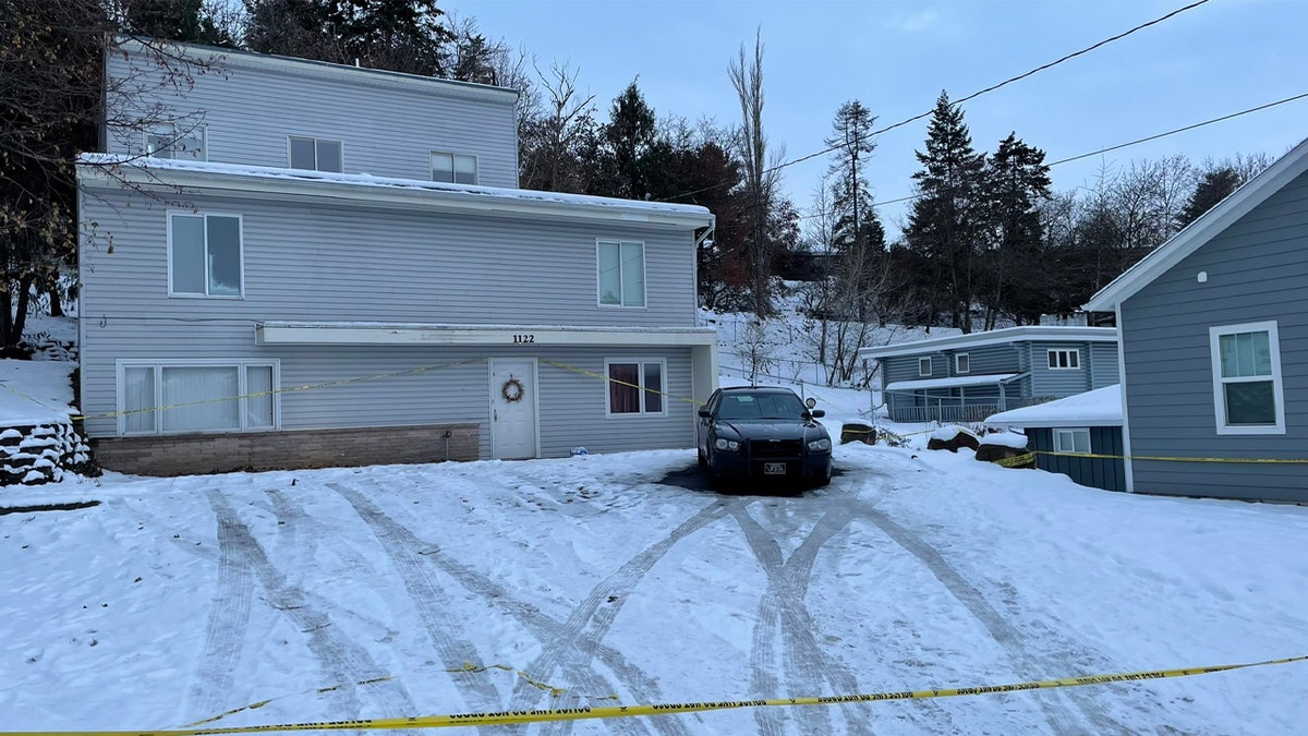 King Road house, tire marks in snow, police tape